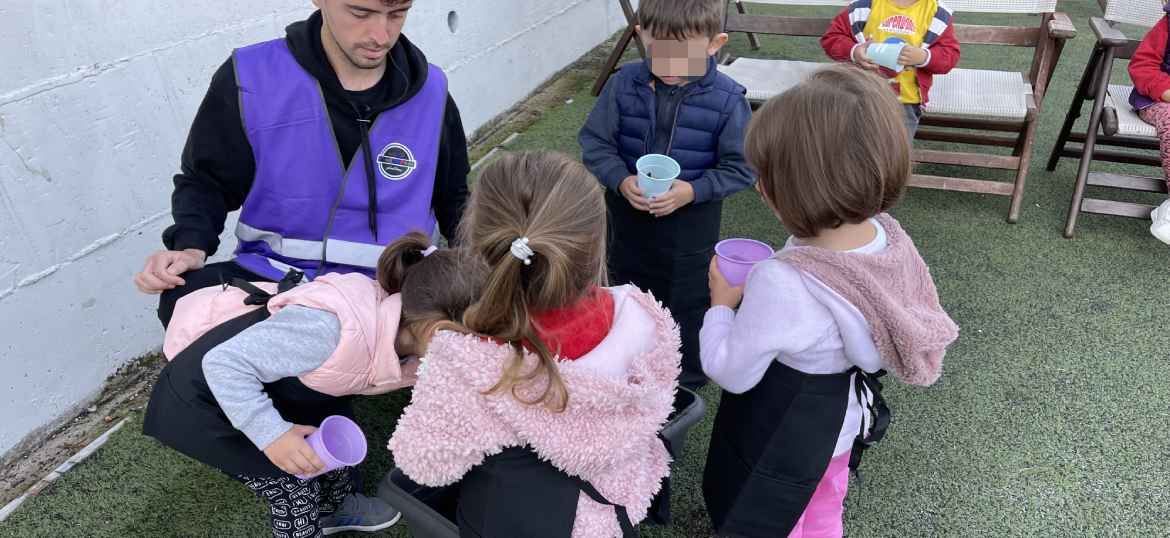 Kids sitting with their teacher