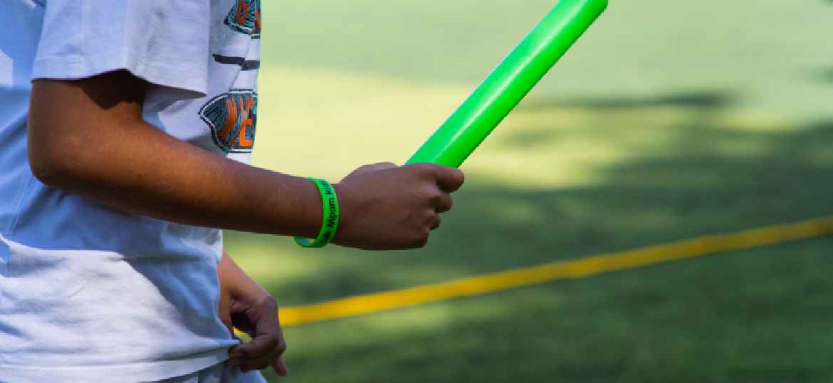 A boy holding a baton